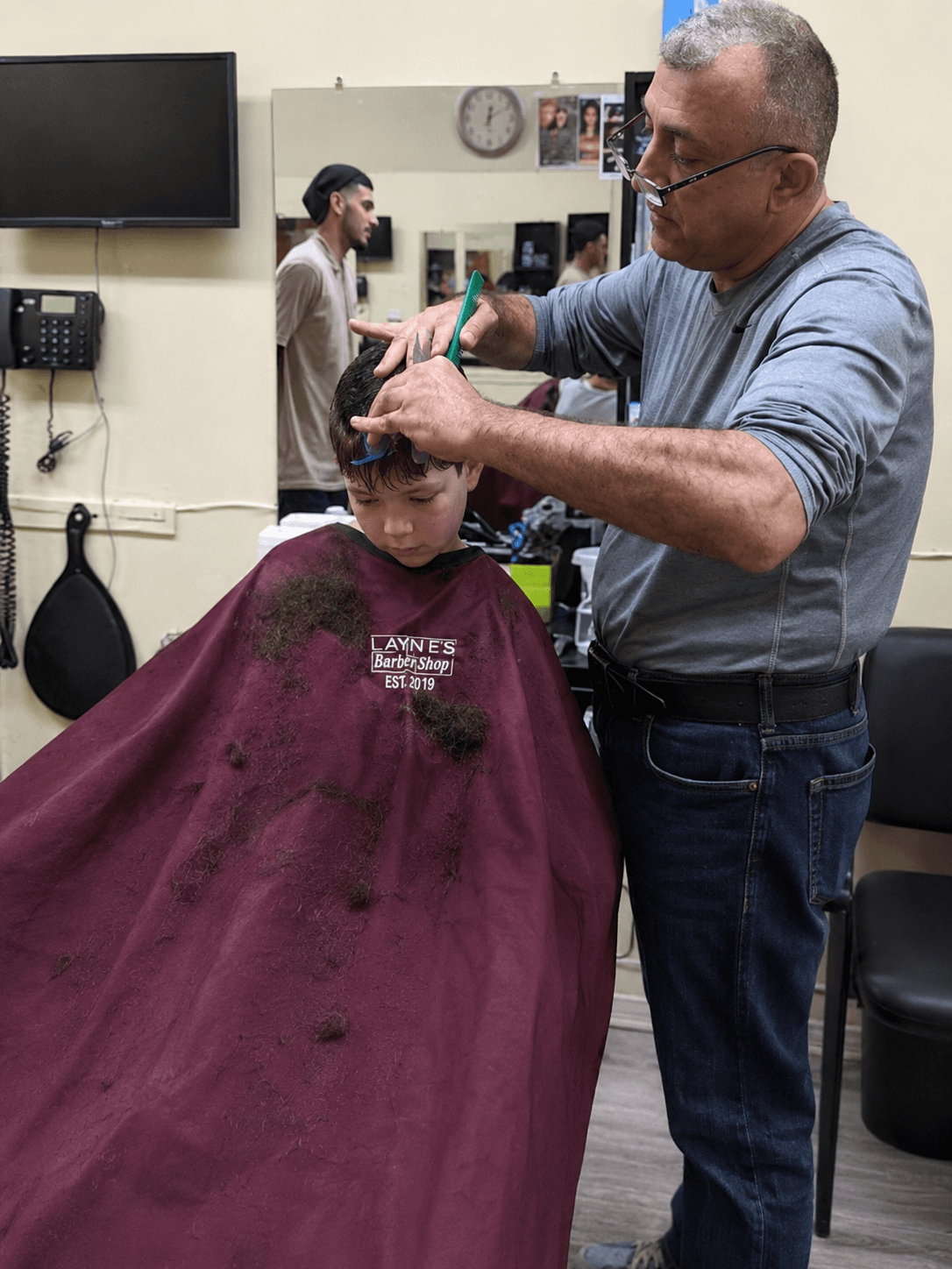 Larry cutting hair — over a decade of craft